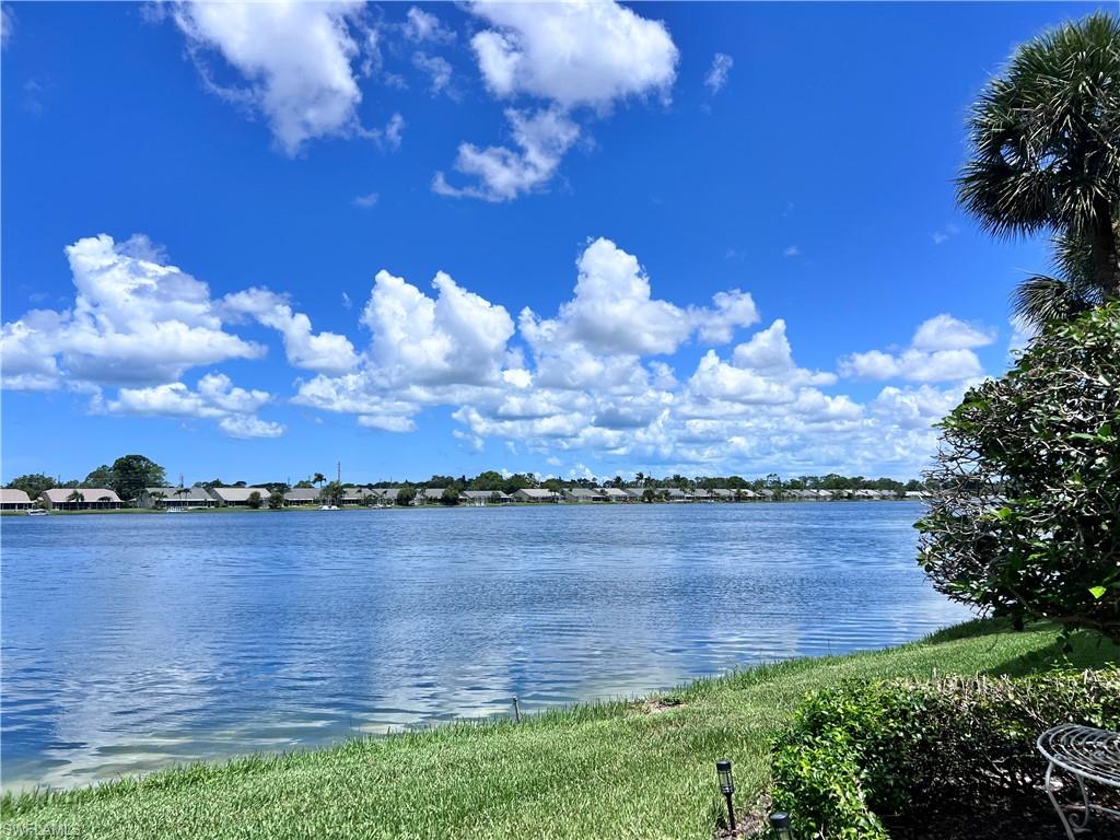 3250 West Crown Pointe Boulevard, Unit 101 Naples, FL 34112 - Photo 31 of 46 a view of a lake