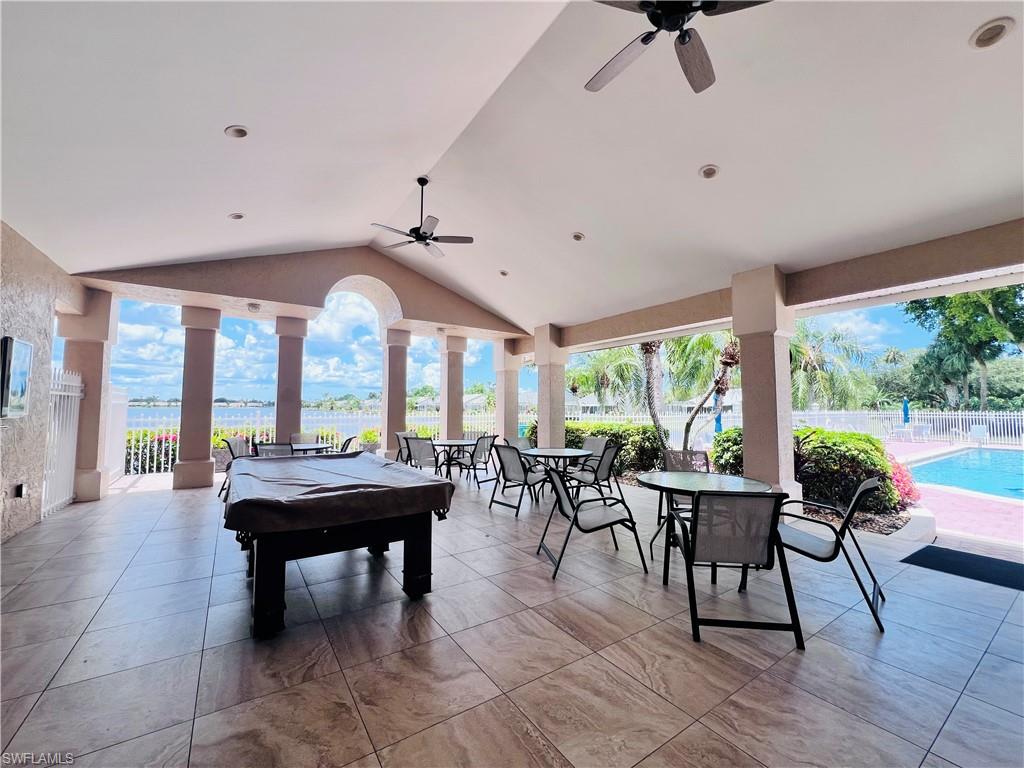 3250 West Crown Pointe Boulevard, Unit 101 Naples, FL 34112 - Photo 39 of 46 a very nice looking living room with a large window and dining table