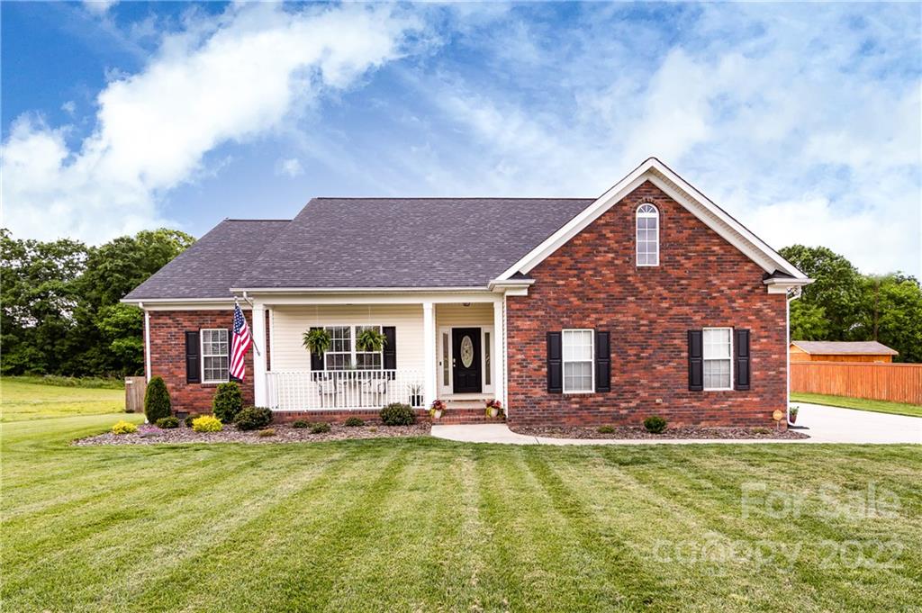 2707 Falling Leaf Court Monroe, NC 28110 - Photo 1 of 36 a front view of house with yard and outdoor seating