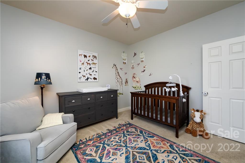 2707 Falling Leaf Court Monroe, NC 28110 - Photo 27 of 36 a bedroom with furniture and a window