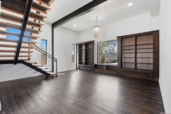 a kitchen with a sink a counter top space cabinets and stainless steel appliances