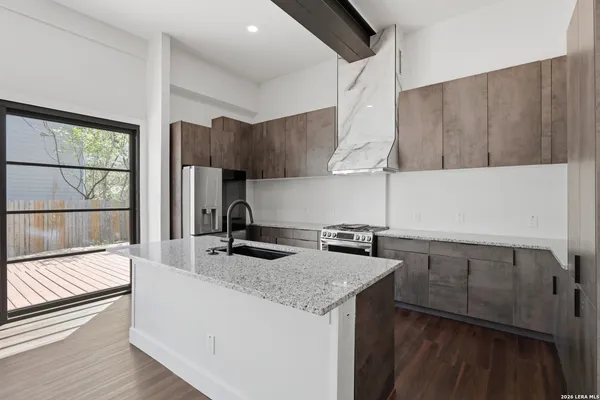 a view of a living room and kitchen