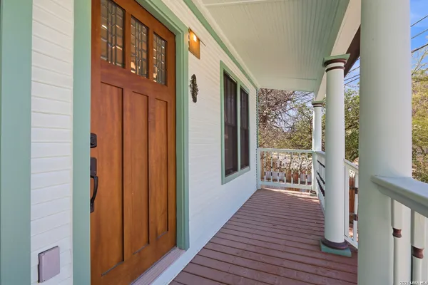 a kitchen with a refrigerator and a stove top oven