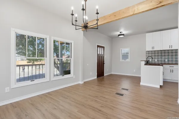 a kitchen with stainless steel appliances a refrigerator sink and cabinets
