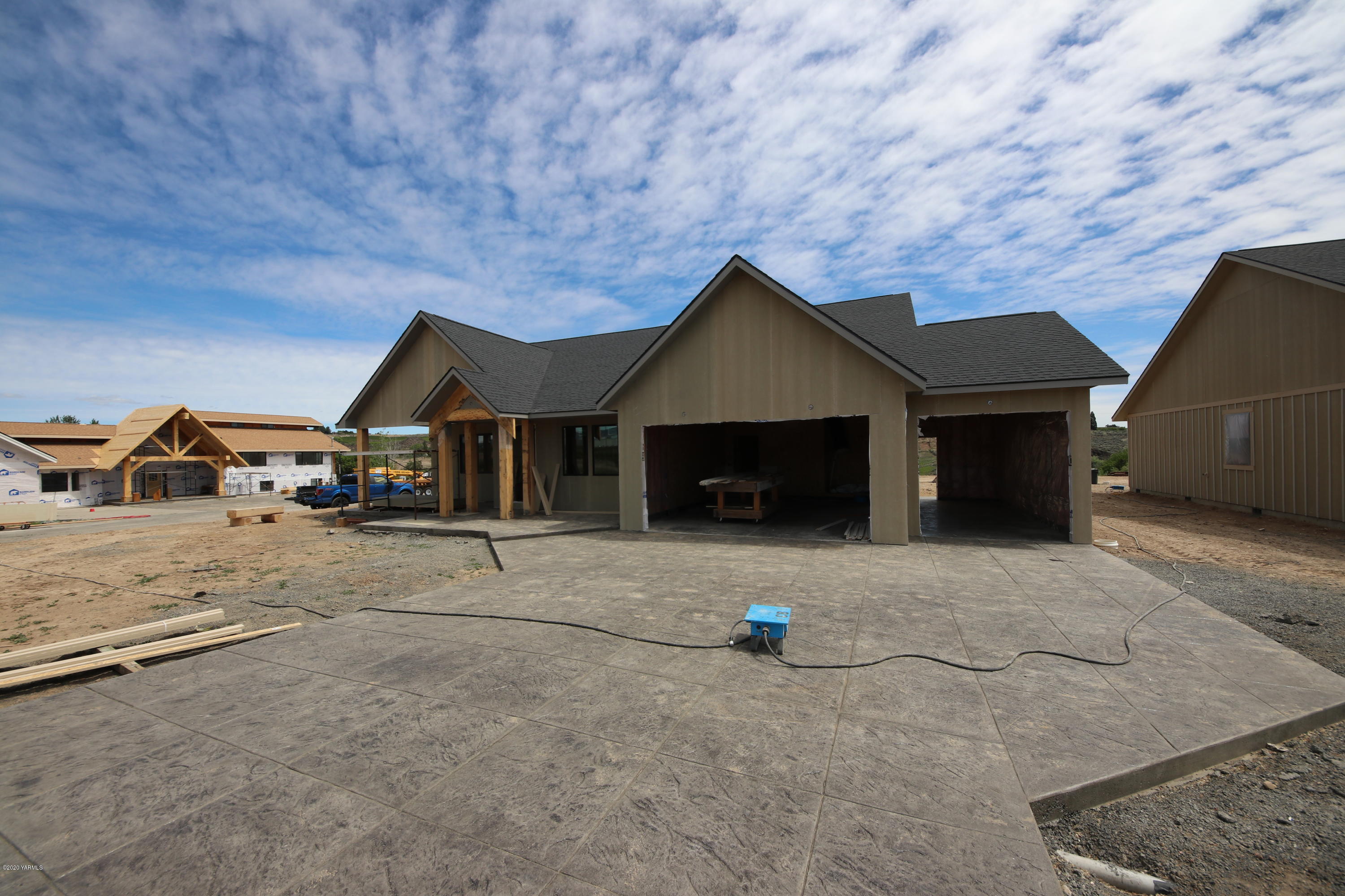 a front view of a house with parking space