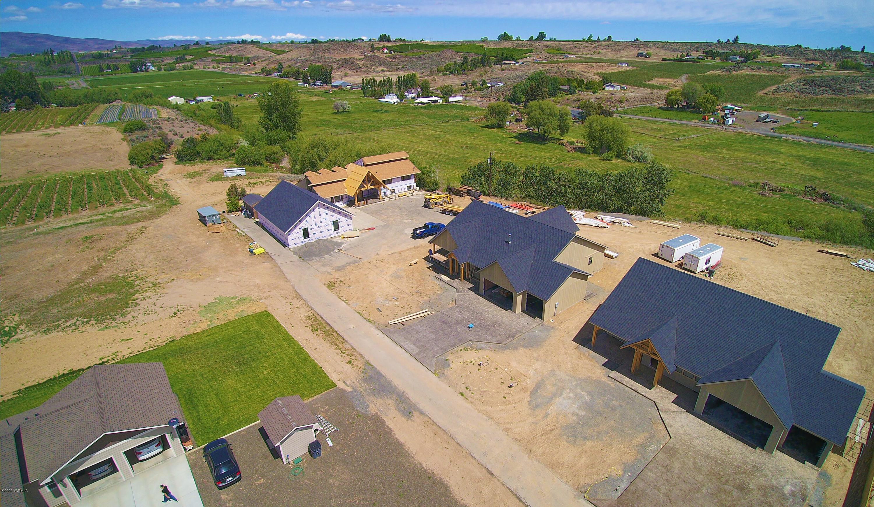 489 Elliott Road Cowiche, WA 98923 - Photo 5 of 10 an aerial view of a house with garden space and mountain view in back