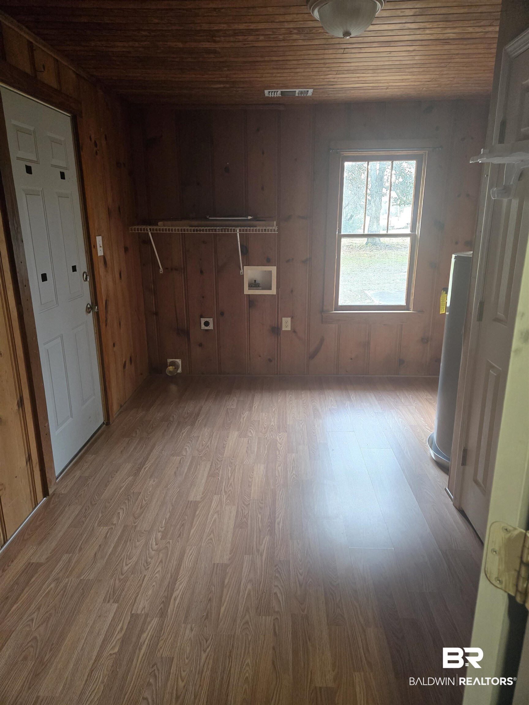 16360 Tolbert Road Bay Minette, AL 36507 - Photo 8 of 14 Unfurnished living room featuring wood ceiling, wood finished floors, and wooden walls
