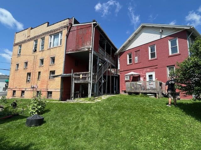 224 Butler Street Springdale, PA 15144 - Photo 9 of 14 a front view of a building with a garden
