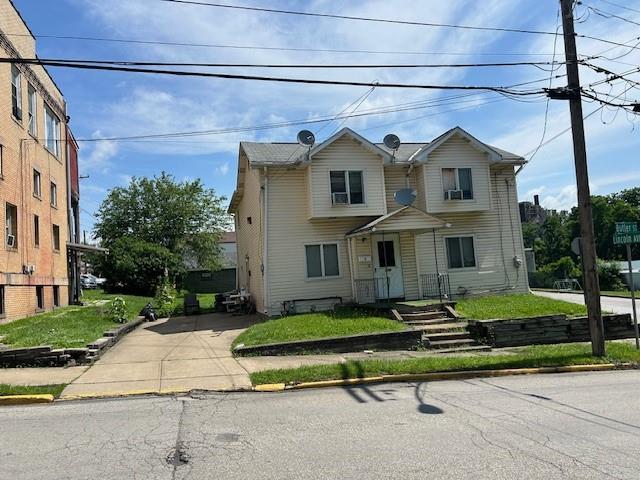 224 Butler Street Springdale, PA 15144 - Photo 10 of 14 a front view of a house with a yard