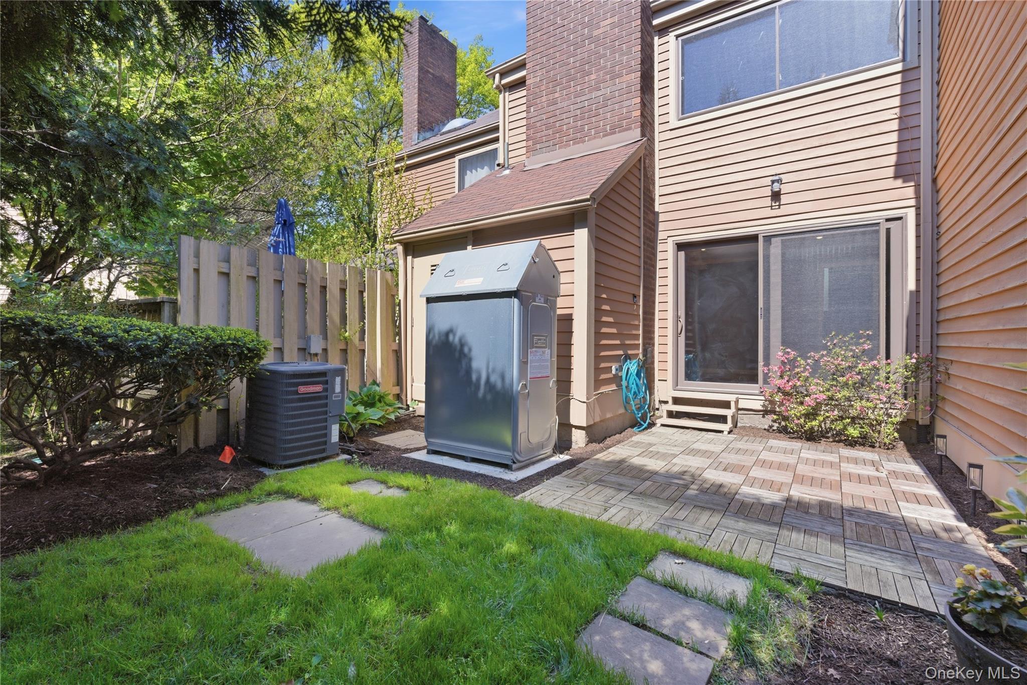 245 Tree Top Crescent Rye Brook, NY 10573 - Photo 13 of 24 a view of a house with backyard and a garden
