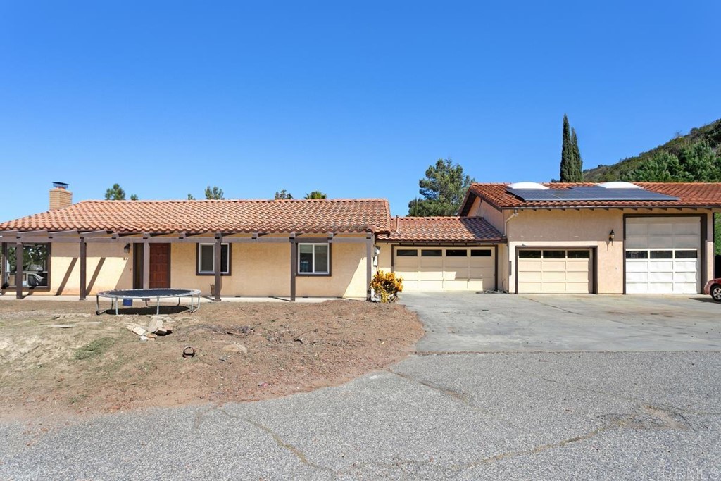 31131 Old River Road Bonsall, CA 92003 - Photo 1 of 1 front view of a house with a street