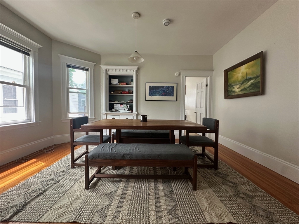 62 Bromfield Road, Unit 2 Somerville, MA 02144 - Photo 4 of 14 a living room with furniture and a flat screen tv