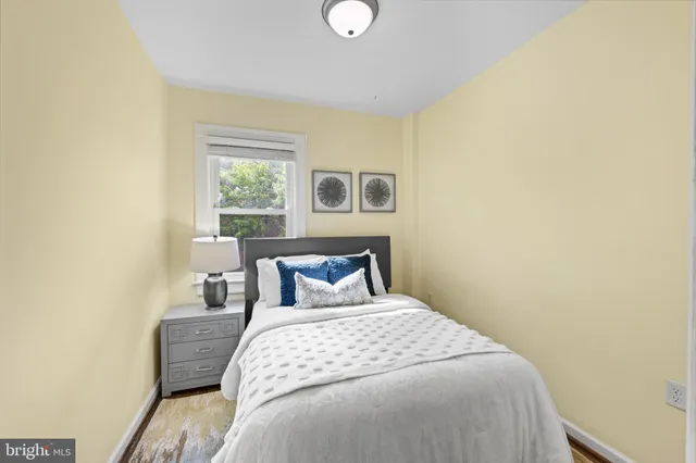a bedroom with a bed and window