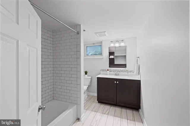 a bathroom with a sink and a bathtub