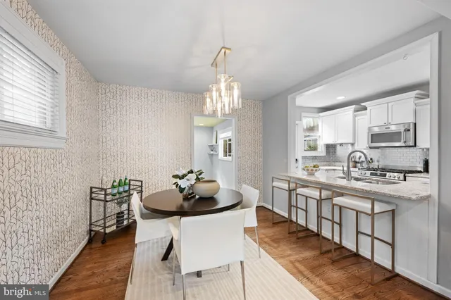 a kitchen with stainless steel appliances kitchen island granite countertop a sink and cabinets