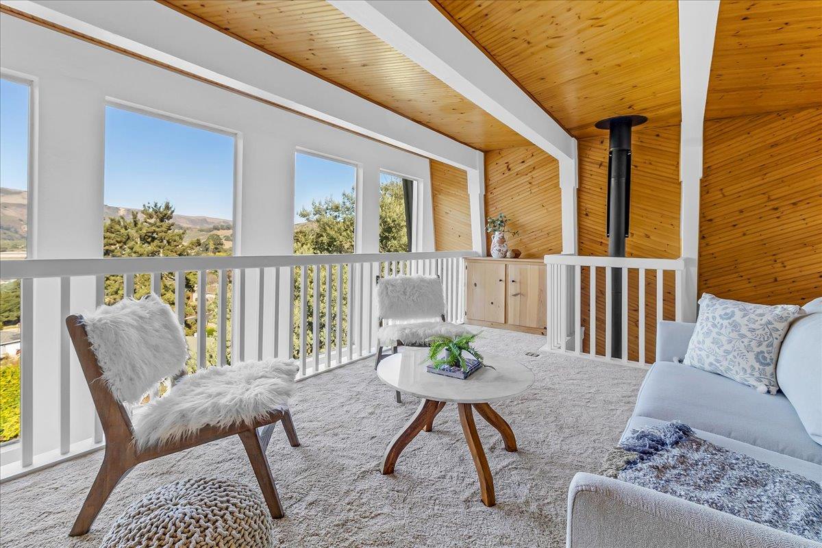 3560 Viola Drive Aromas, CA 95004 - Photo 17 of 42 a balcony with furniture and wooden floor