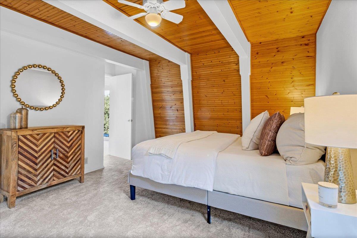 3560 Viola Drive Aromas, CA 95004 - Photo 26 of 42 a bedroom with a bed and a lamp