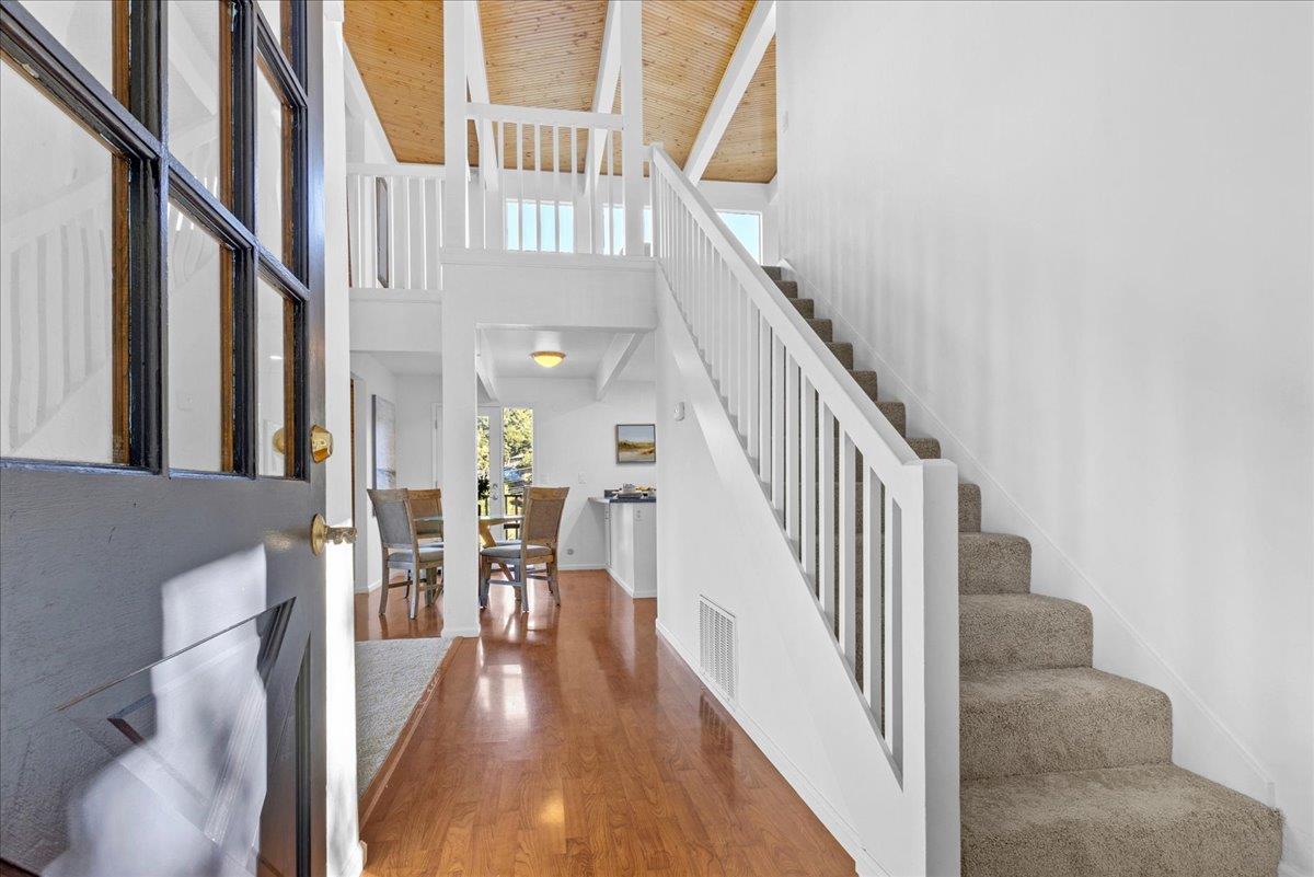 3560 Viola Drive Aromas, CA 95004 - Photo 35 of 42 a view of a hallway with wooden floor table and chairs