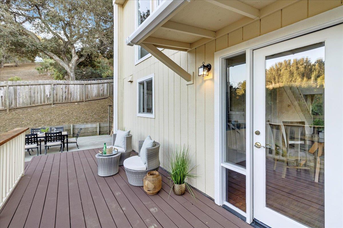 3560 Viola Drive Aromas, CA 95004 - Photo 36 of 42 a view of a deck with table and chairs and wooden floor