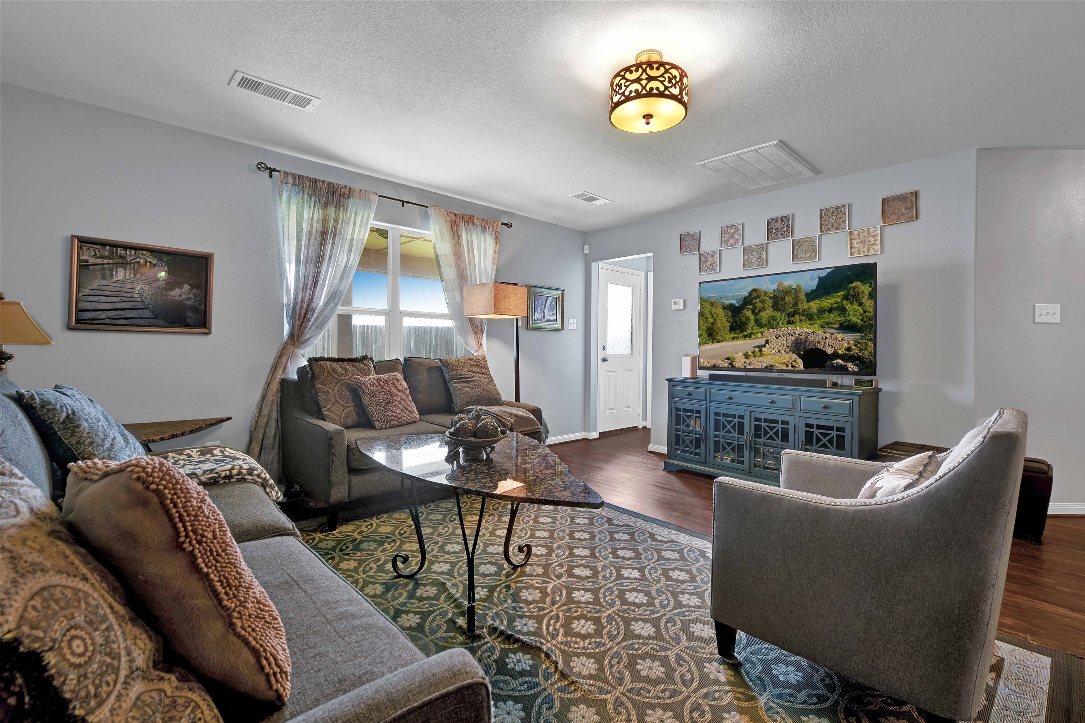 1827 Garnet Breeze Drive Rosharon, TX 77583 - Photo 6 of 23 a living room with furniture and a flat screen tv