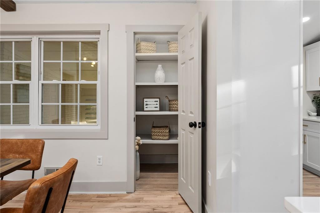 2771 Sherwood Road Southeast Smyrna, GA 30082 - Photo 13 of 40 a view of a livingroom with wooden floor and a cabinet