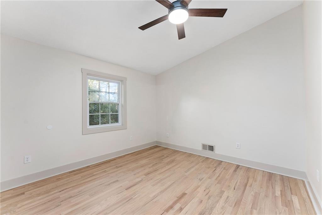 2771 Sherwood Road Southeast Smyrna, GA 30082 - Photo 18 of 40 an empty room with a window and a ceiling fan