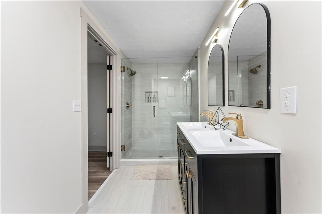 2771 Sherwood Road Southeast Smyrna, GA 30082 - Photo 23 of 40 a bathroom with a sink and a mirror