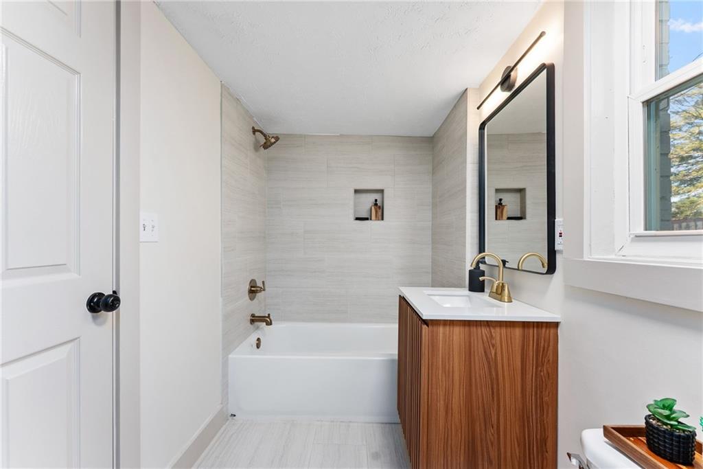 2771 Sherwood Road Southeast Smyrna, GA 30082 - Photo 26 of 40 a bathroom with a tub sink and mirror