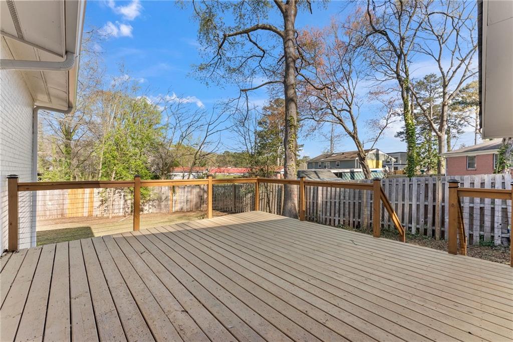 2771 Sherwood Road Southeast Smyrna, GA 30082 - Photo 28 of 40 a view of roof deck with wooden floor and fence