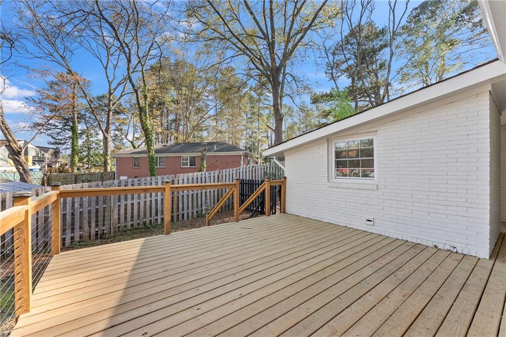 2771 Sherwood Road Southeast Smyrna, GA 30082 - Photo 30 of 40 a view of a house with wooden deck