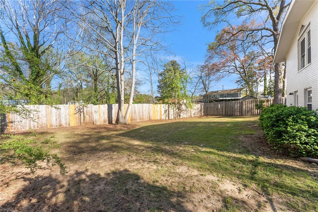 2771 Sherwood Road Southeast Smyrna, GA 30082 - Photo 34 of 40 a view of a yard with plants and trees
