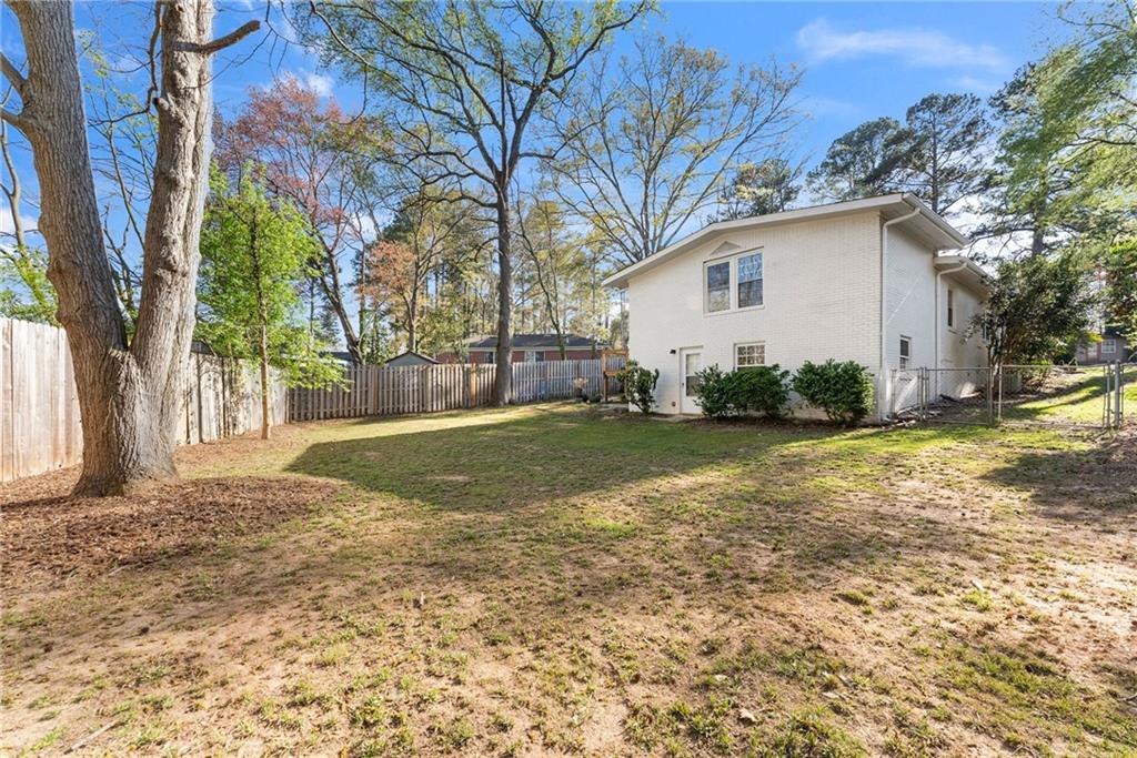 2771 Sherwood Road Southeast Smyrna, GA 30082 - Photo 35 of 40 a view of backyard of house with green space