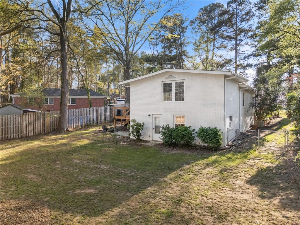 2771 Sherwood Road Southeast Smyrna, GA 30082 - Photo 37 of 40 a backyard of a house with yard and outdoor seating