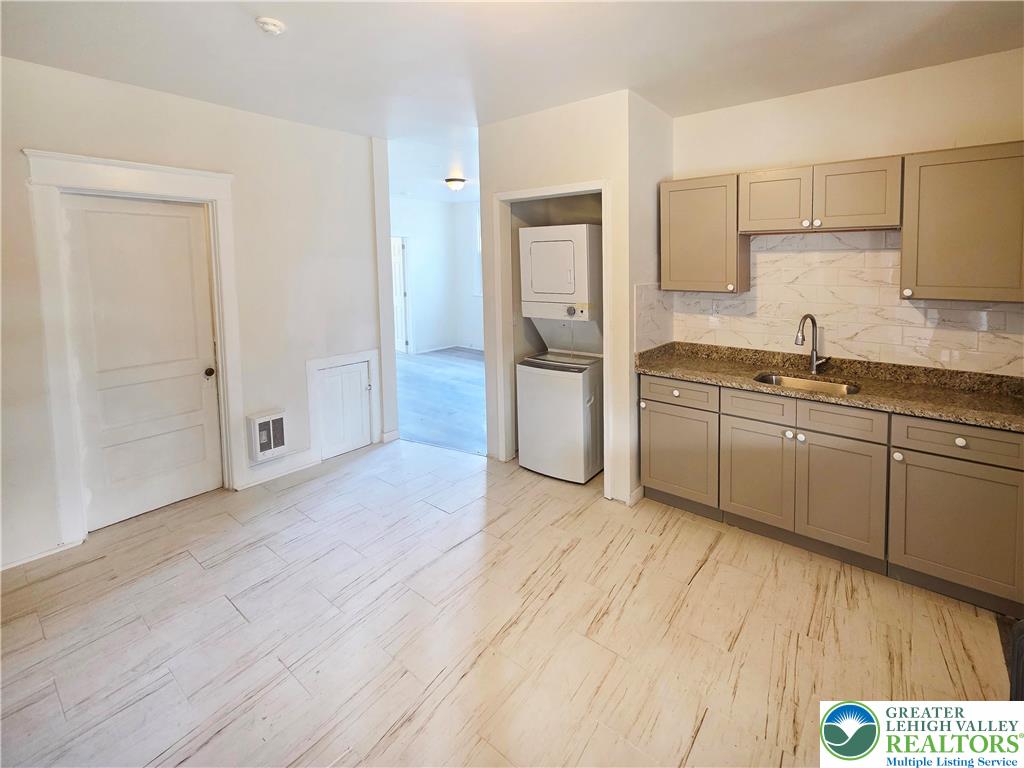 1401 Broadway, Unit 2 Bethlehem, PA 18015 - Photo 3 of 7 a kitchen with stainless steel appliances a sink cabinets and wooden floor