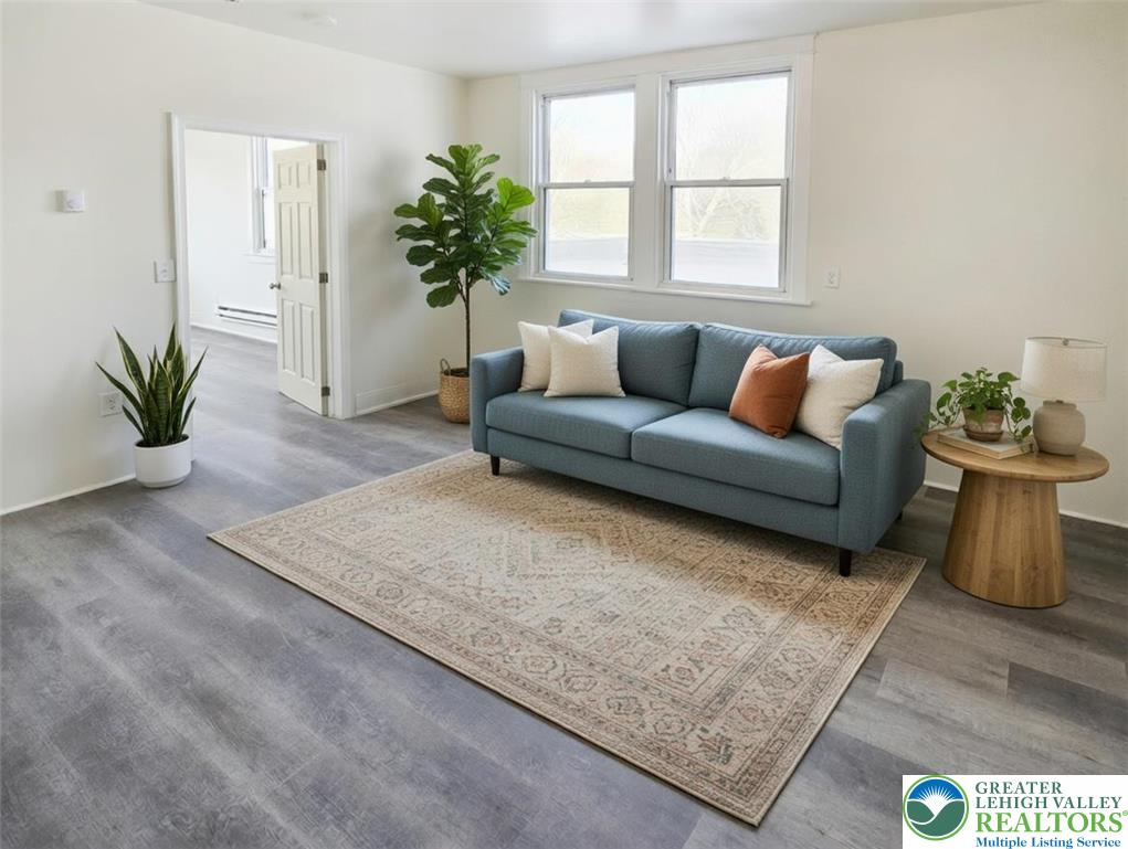 1401 Broadway, Unit 2 Bethlehem, PA 18015 - Photo 4 of 7 a living room with furniture and a potted plant