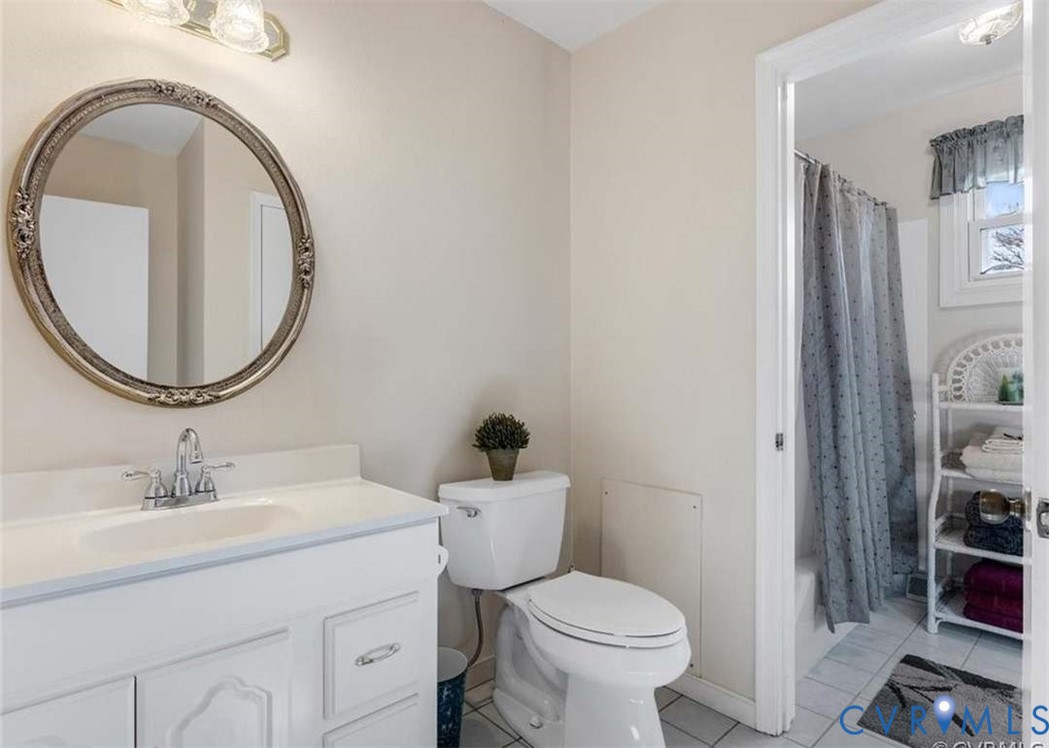 9003 Hungary Road Henrico, VA 23294 - Photo 17 of 25 White vanity with integrated sink and chrome fauce