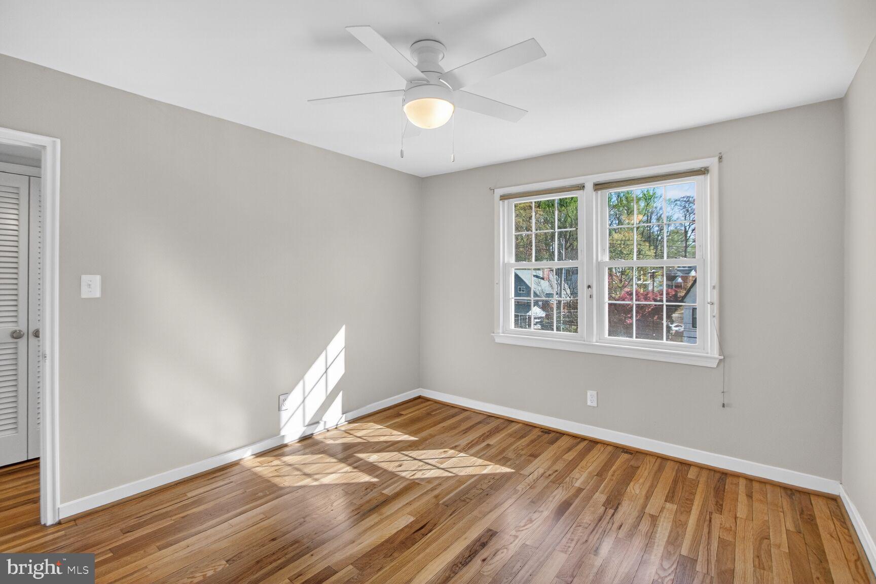 8205 Grubb Road, Unit G202 Silver Spring, MD 20910 - Photo 17 of 38 a view of empty room with wooden floor and fan