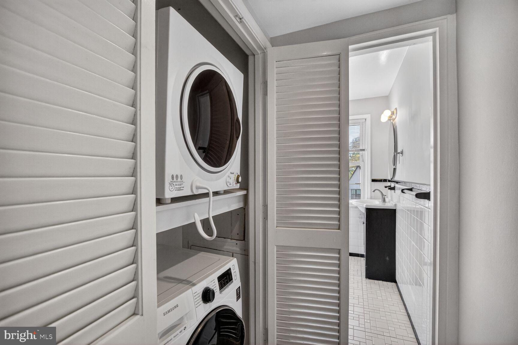 8205 Grubb Road, Unit G202 Silver Spring, MD 20910 - Photo 19 of 38 a utility room with dryer and washer