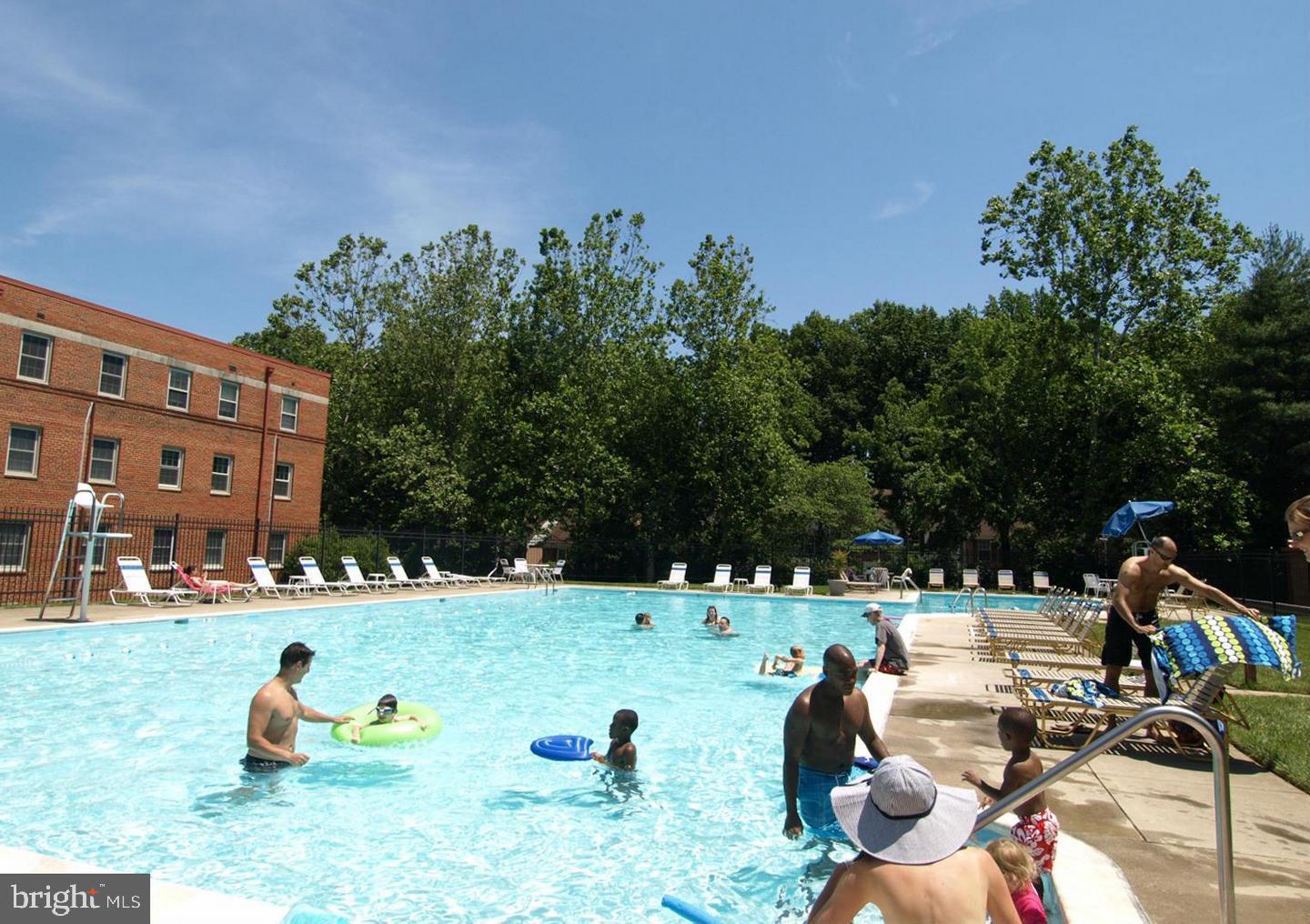 8205 Grubb Road, Unit G202 Silver Spring, MD 20910 - Photo 25 of 38 a view of a swimming pool with a patio