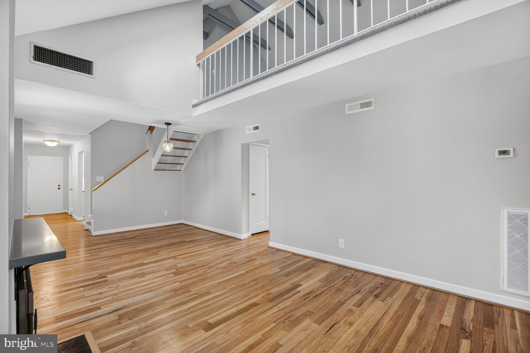 8205 Grubb Road, Unit G202 Silver Spring, MD 20910 - Photo 3 of 38 a view of an empty room with wooden floor