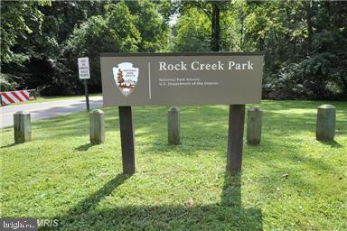 8205 Grubb Road, Unit G202 Silver Spring, MD 20910 - Photo 32 of 38 a view of a park with welcome board