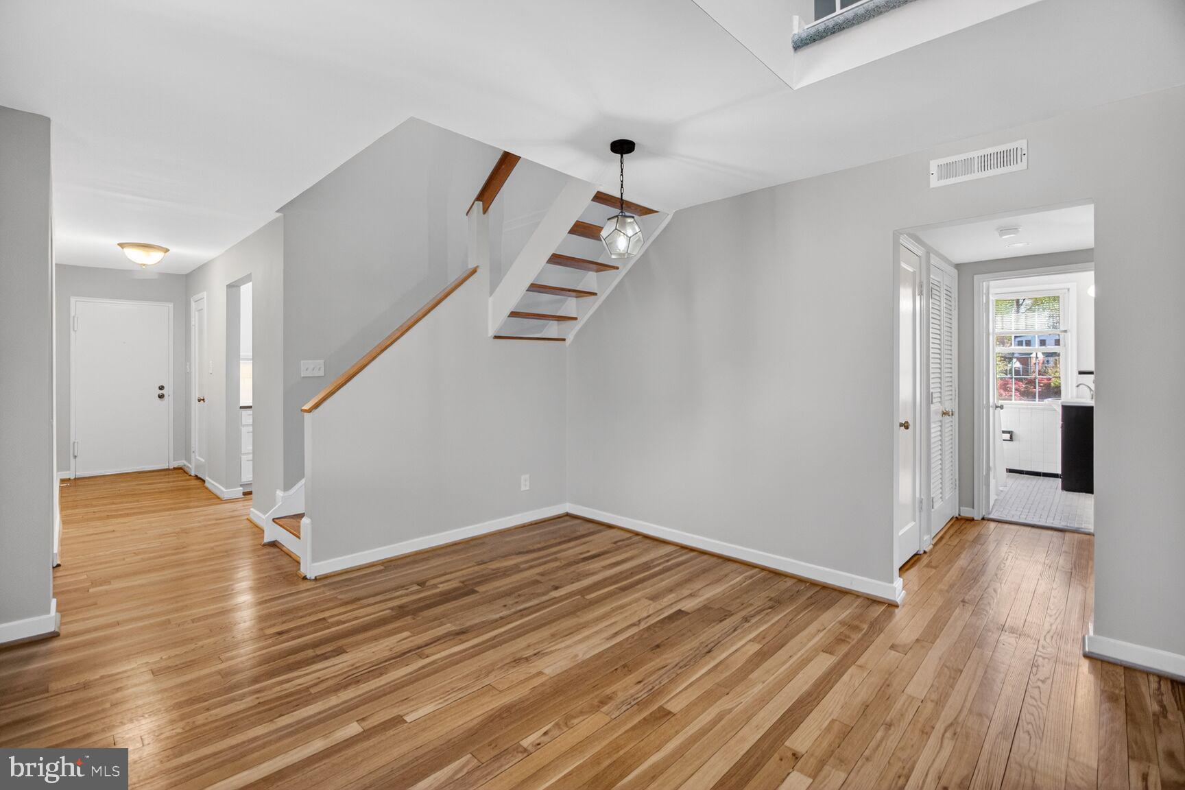 8205 Grubb Road, Unit G202 Silver Spring, MD 20910 - Photo 9 of 38 a view of a room with wooden floor and staircase