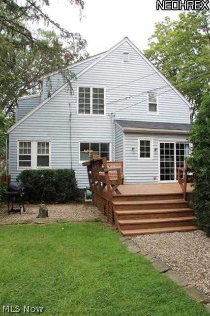 2591 Eaton Road Cleveland, OH 44118 - Photo 15 of 17 From the landscaped backyard, a view of party-sized deck with plenty of seating.