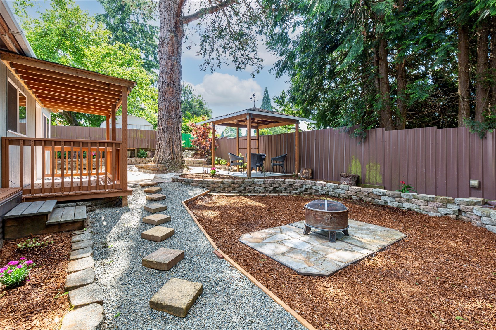 2115 Northeast 8th Street Renton, WA 98056 - Photo 14 of 19 a view of a backyard with sitting area and furniture