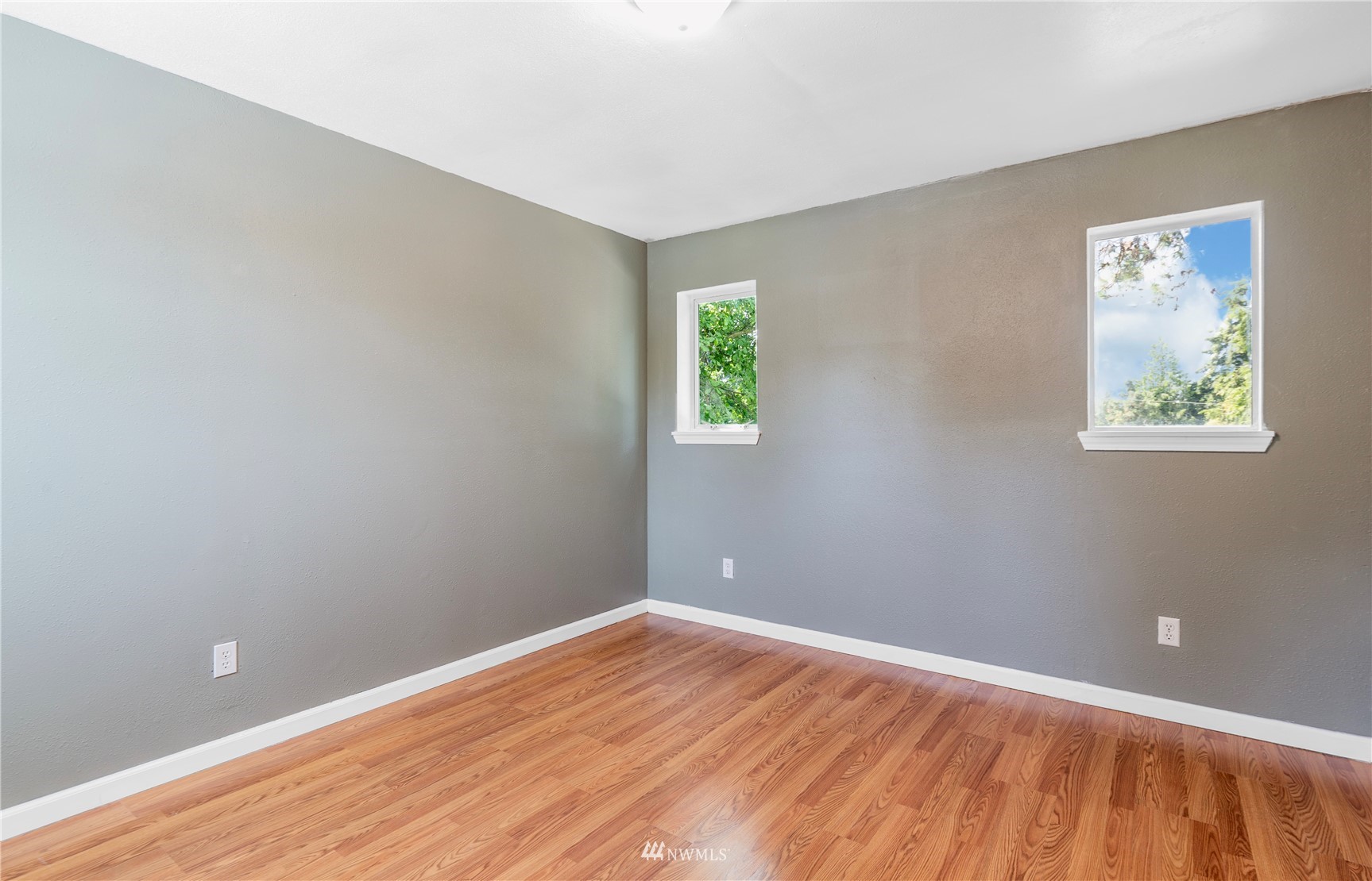 2115 Northeast 8th Street Renton, WA 98056 - Photo 17 of 19 wooden floor in an empty room with a window