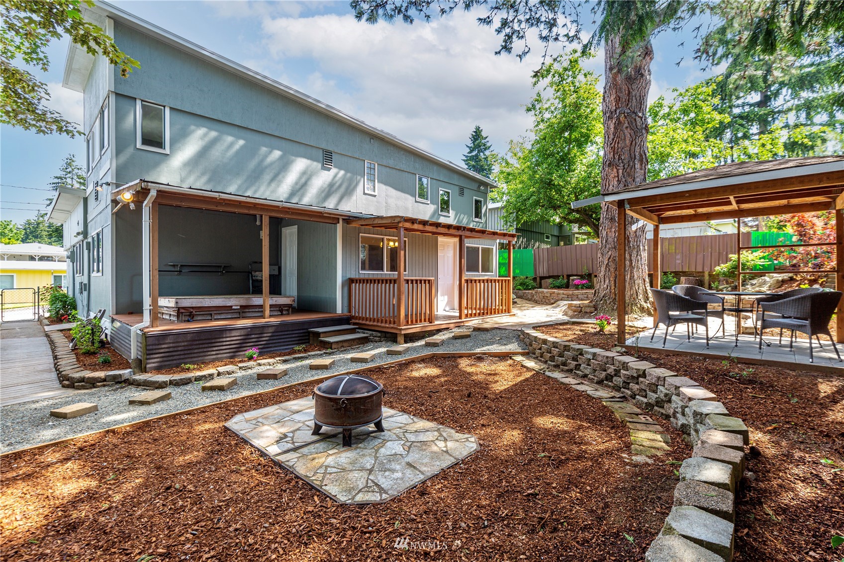 2115 Northeast 8th Street Renton, WA 98056 - Photo 7 of 19 a view of a house with backyard porch and sitting area