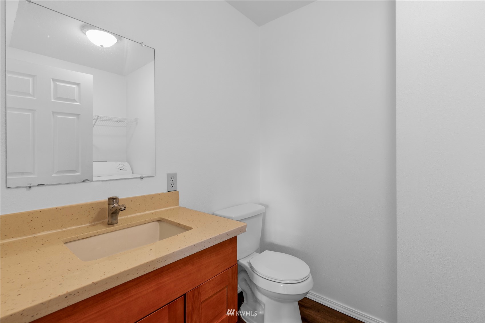 2115 Northeast 8th Street Renton, WA 98056 - Photo 8 of 19 a bathroom with a sink and a toilet