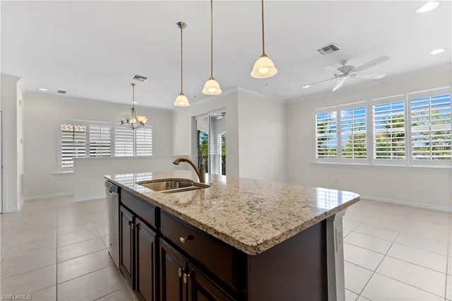 a kitchen with granite countertop cabinets and a stove