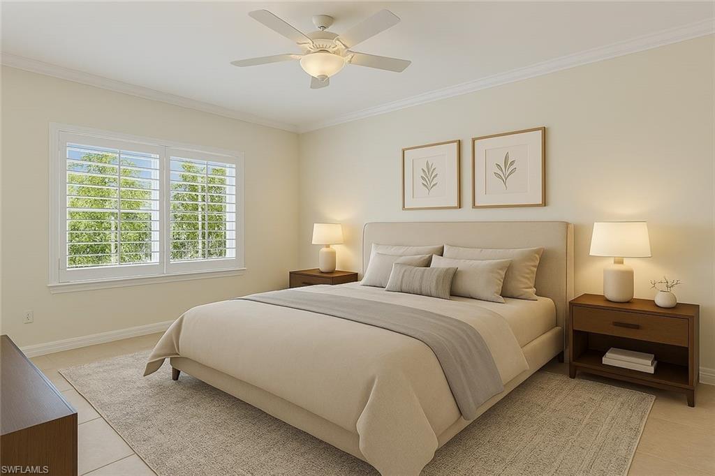 8531 Violeta Street, Unit 203 Estero, FL 34135 - Photo 14 of 35 a bedroom with a bed and a chandelier