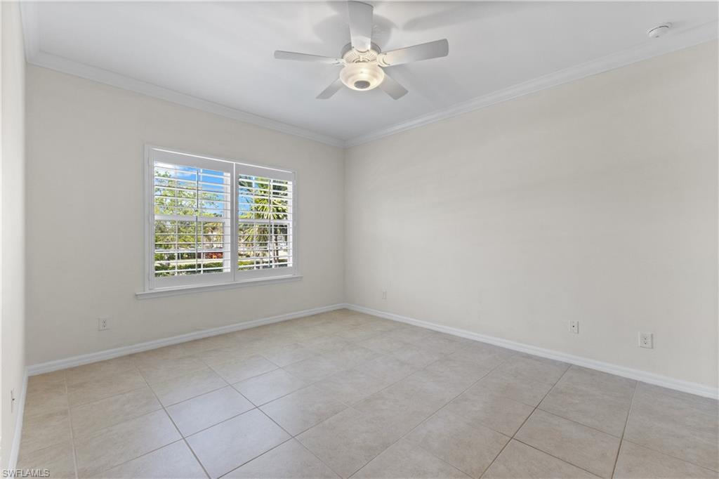 8531 Violeta Street, Unit 203 Estero, FL 34135 - Photo 15 of 35 wooden floor in an empty room with a window